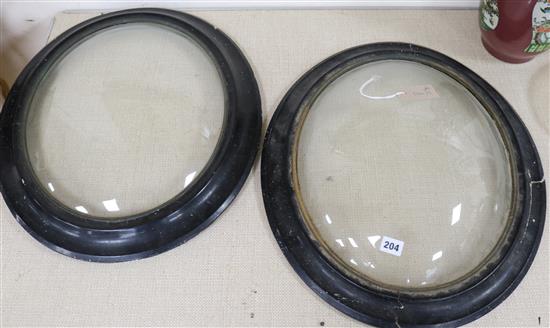 A pair of convex glazed frames length 57cm